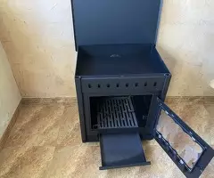 Estufa de leña grande con salida de humos por detras y horno - 5